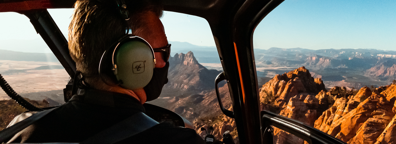 Helicopter cockpit over canyon country