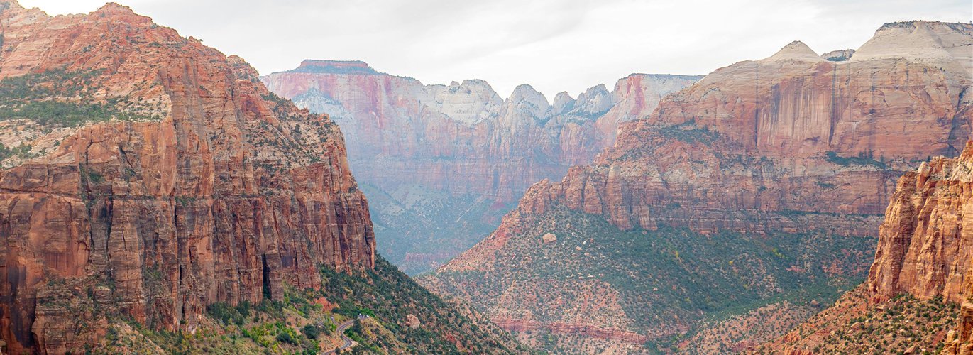 Helicopter flying near Zion red rock cliffs